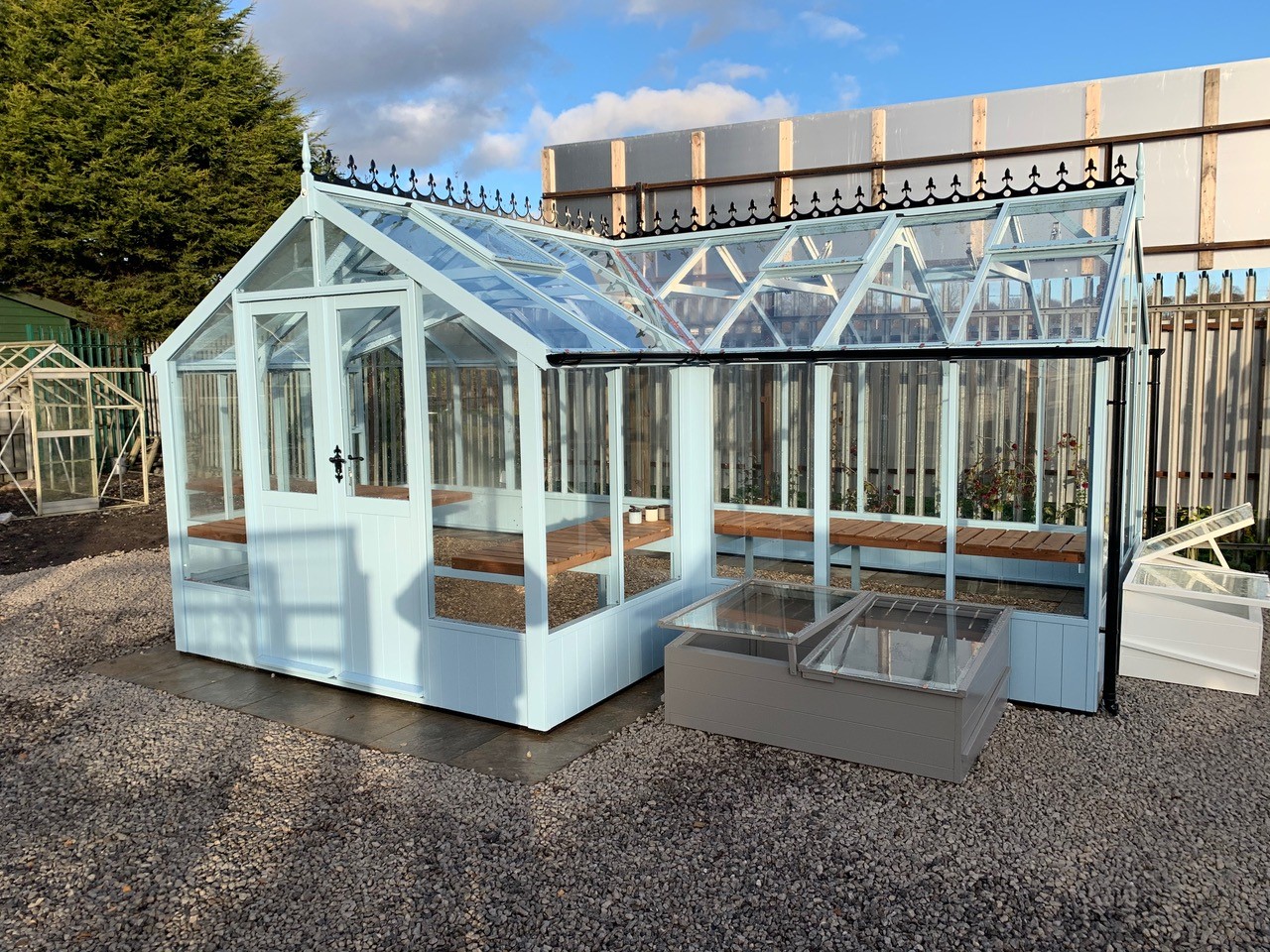 Swan 8'9 x 21'11 greenhouse painted Robin's Egg Blue and optional cresting